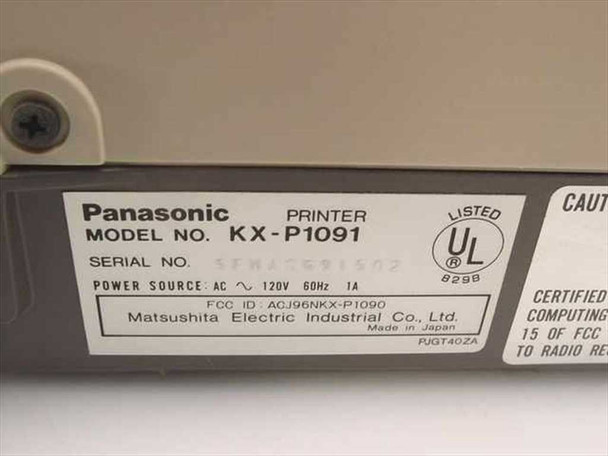 Panasonic KX-P1091 bottom label showing model number, 120V 60Hz 1A power spec, serial number, FCC ID, and Matsushita Electric Industrial Co. Made in Japan