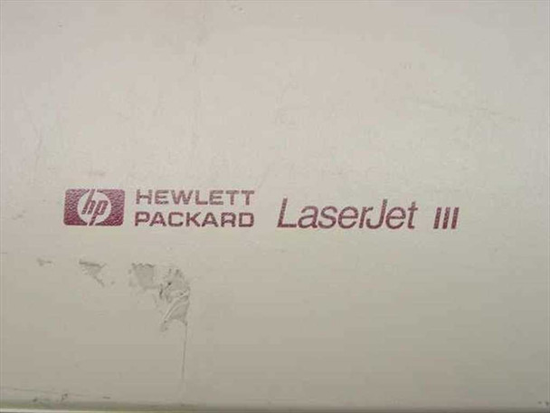 HP 33449A LaserJet III top cover close-up showing Hewlett-Packard LaserJet III logo with sticker residue mark visible