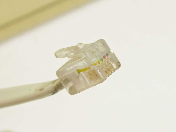 DEC LK201BA keyboard RJ11 connector close-up showing 6-position plug and wiring