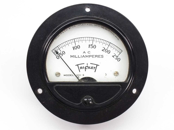 Triplett 331-S panel meter front angled view showing full round black bezel and analog needle gauge face