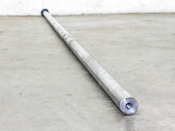 Thomson RoundRail linear guide rod — angled view of machined end face showing center bore and black clamp collar near end