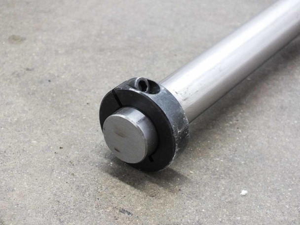 Close-up of the end cap and retaining collar on the Thomson RoundRail RL linear guide rod showing slotted collar detail