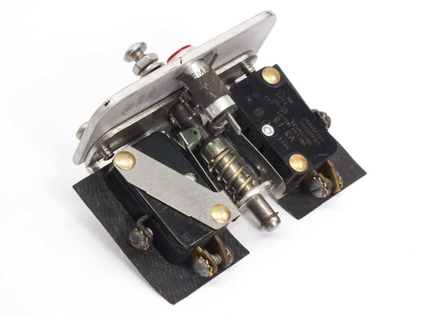 Honeywell V3-13 micro switch assembly — angled rear view showing two V3-13 snap-action switches mounted on black base with spring actuator mechanism