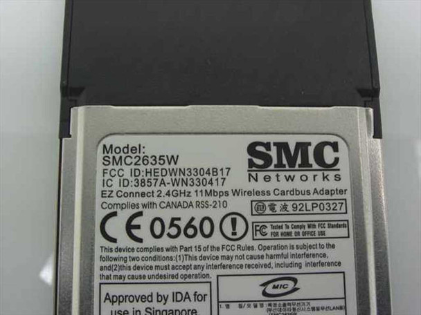 SMC Networks SMC2635W — rear label showing FCC ID HEDWN3304B17, IC ID, CE 0560 mark, and regulatory compliance text
