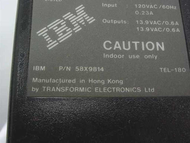 IBM 58X9814 TEL-180 adapter rating label showing dual 13.9VAC/0.6A outputs, 120VAC/60Hz input, manufactured by Transformic Electronics Ltd in Hong Kong