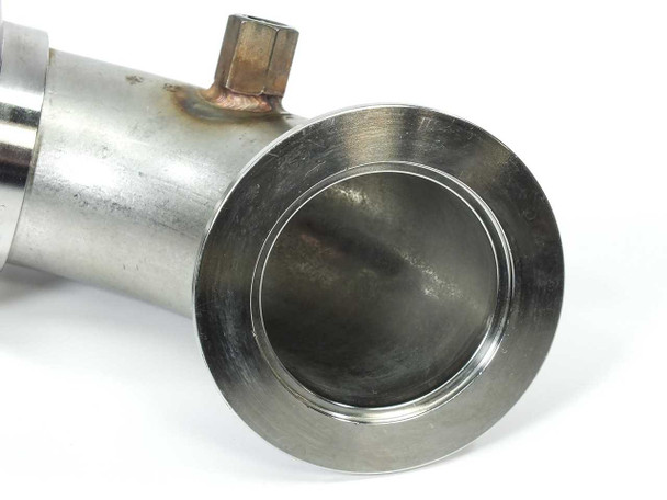 Second DN50KF flange bore view showing interior of elbow and feedthrough hex fitting stub with heat discoloration visible at weld