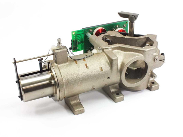 Nicolet Magna Magnum End Plate Board 000-869102 — right-side view showing full cast metal body with cylindrical bore, mounting feet, and PCB with red-wire coil components
