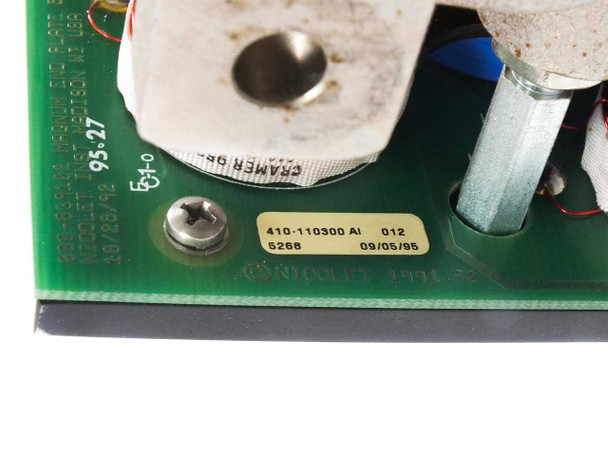 Nicolet 410-110300 assembly label close-up — yellow label reading '410-110300 A1 012, 6268, 09/05/95' on the green PCB surface