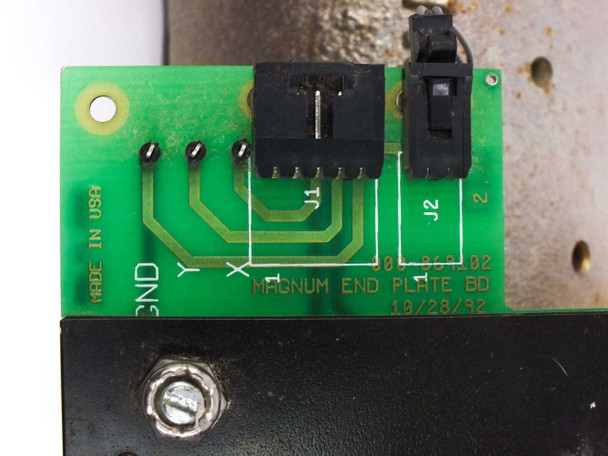 Nicolet 000-869102 Magnum End Plate Board — PCB reverse/connector side showing silkscreen 'MAGNUM END PLATE BD 10/28/92', connector headers J1 and J2, GND/Y/X labels, and 'MADE IN USA' marking