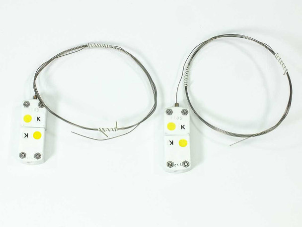 Two Omega SCASS-020U-60-SHX Type K quick-disconnect thermocouple probes with 60-inch ceramic sheaths laid flat on white background