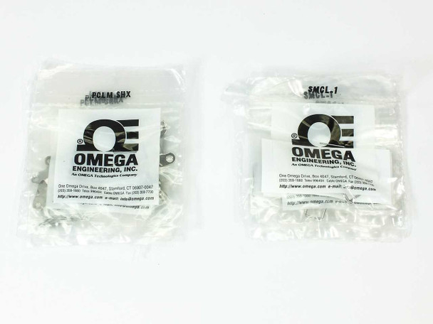 Two sealed Omega Engineering accessory bags — PCLM-SHX cable clamps (left) and SMCL-1 safety clips (right)