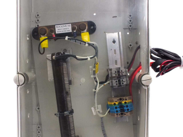Interior of solar panel test enclosure showing Ohmite coil resistor, DIN rail terminal blocks, Simpson shunt, and maximum voltage label