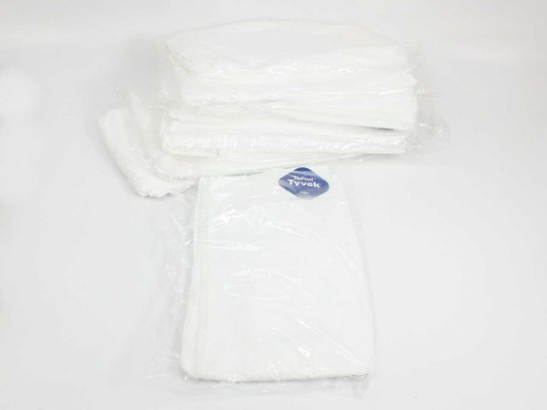 Lot of 11 DuPont Tyvek disposable coveralls individually packaged in clear poly bags, stacked together