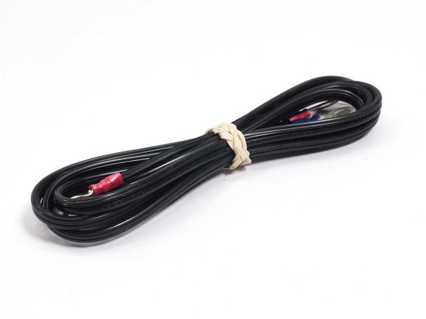 Included lead wire coiled — black two-conductor wire with ring terminal on one end