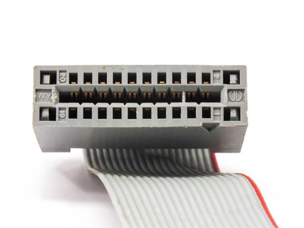 IBM 134-1585 floppy cable — close-up of edge connector end, gray housing with exposed gold contacts for 5.25-inch floppy drive connection