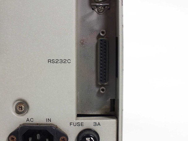SATO M-8400 RS-232C serial interface port close-up showing DB-25 connector and rear panel with AC IN IEC inlet and 3A fuse holder