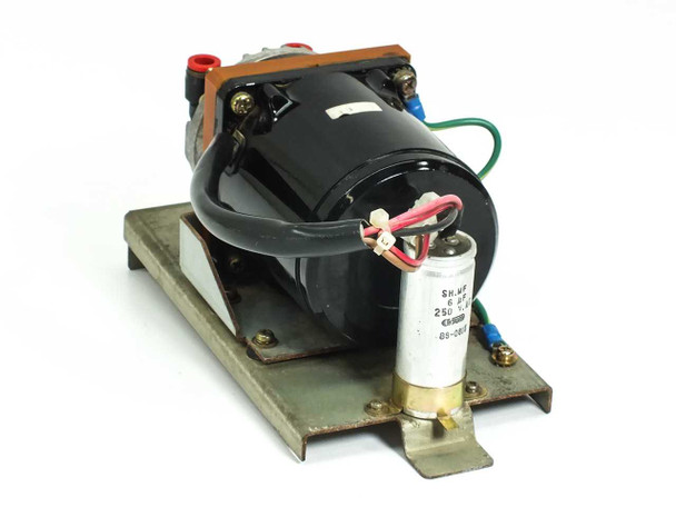 Japan Servo UIH8S25 induction motor rear view showing black motor body, green ground wire, and SH.MF 6uF 250VAC run capacitor mounted on base plate