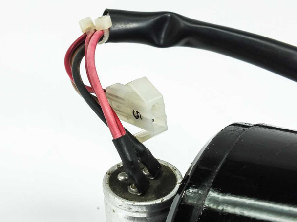Close-up of Japan Servo UIH8S25 motor pigtail lead wires with 2-pin white connector – red and black leads shown