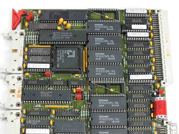 Netstal Sycap CPU 286 board close-up upper-left — AMD CPU chip, NEC Japan IC, multiple Toshiba TC55257DPL-70L SRAM chips, yellow tantalum capacitors