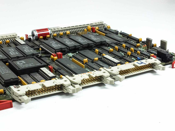 Netstal 100.240.7771 Sycap CPU 286 board angled edge view — multiple white pin-header connectors along board edge, red cylindrical capacitors, flatpack ICs