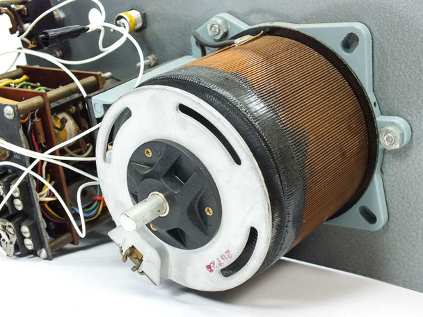 Rear view of SE Variac toroidal autotransformer coil showing copper winding and white plastic brush assembly