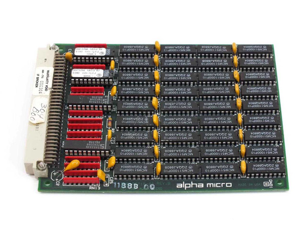 Alpha Micro AM-715 4MB Memory Expansion Board REV B — top component side showing rows of DIP DRAM chips and red DIP switches