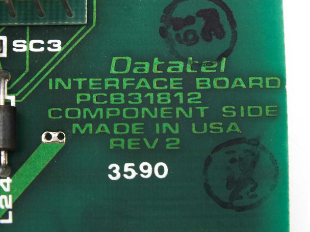 Datatel PCB31812 REV 2 board label closeup — shows Datatel Interface Board, PCB31812, Component Side, Made in USA, REV 2, serial 3590