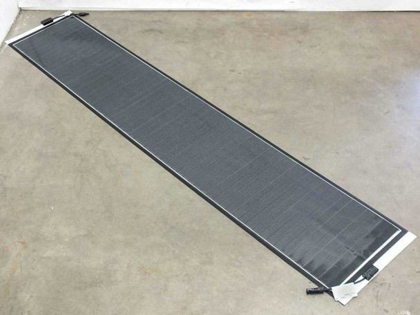 SoloPower SP1-70 70W flexible thin film solar panel laid flat on floor showing full 86.5-inch length and MC4 connectors at each end
