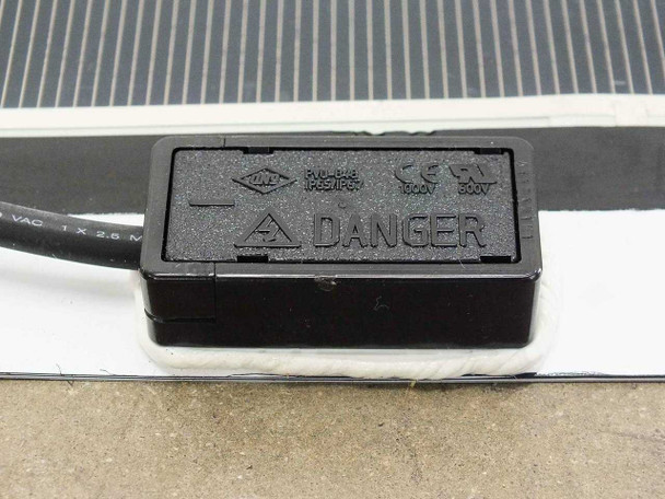 SoloPower SP1-70 junction box mounted on panel edge showing PV0-B48 rating plate, CE and UL certifications, 1000V and 600V ratings