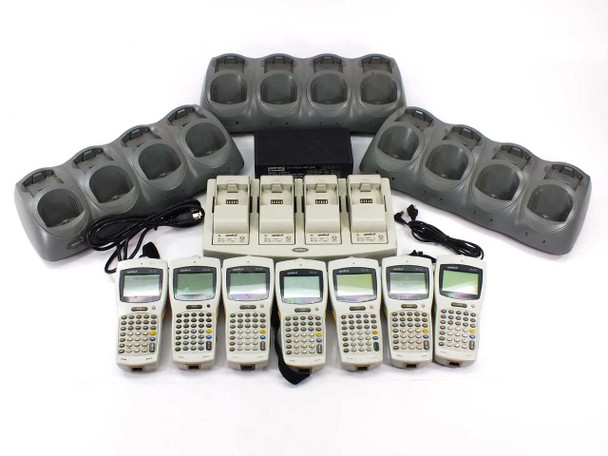 Symbol PDT6100 lot of 7 handheld barcode terminals with four-slot cradle chargers and universal battery charging station — full lot overview