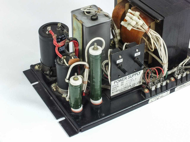 Kitafuji Origin 0038 power supply – left-side three-quarter view showing capacitors, resistors, and power supply data label
