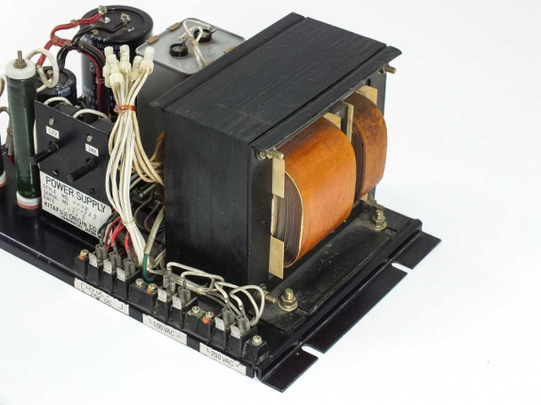 Kitafuji Origin 0038 power supply – right-side three-quarter view showing large transformer core with copper windings and terminal block