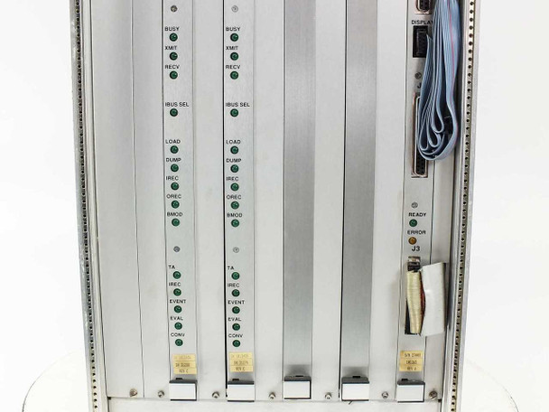 Zycad XP-140 card cage detail showing two SM boards with BUSY, XMIT, RECV, IBUS SEL, LOAD, DUMP, IREC, DMCD, TA, EVAL, CONV LED indicators and CBUSIB board with READY and ERROR LEDs