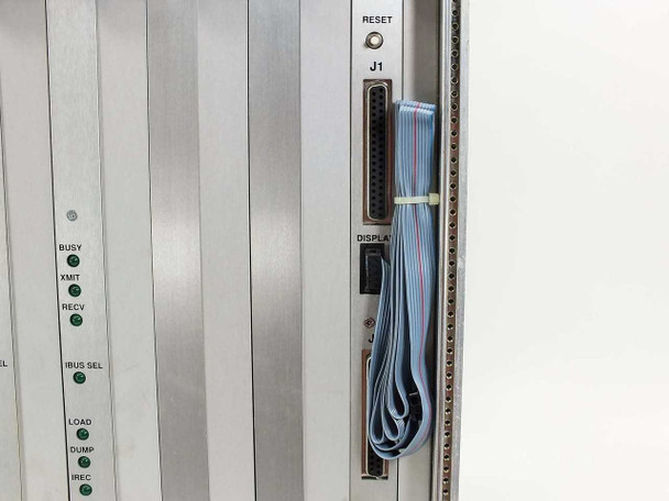Zycad XP-140 card cage close-up showing J1 RESET connector, DISPLAY ribbon cable header, and board slot rail detail