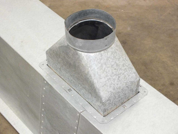 Close-up of top-mounted galvanized round duct collar transition on clean room air duct housing — riveted seams visible