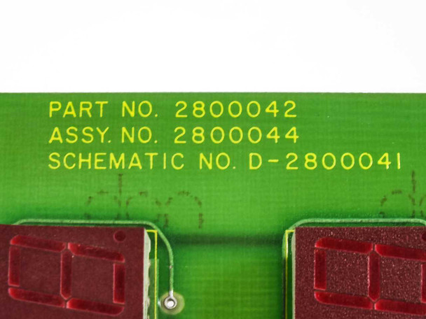 Close-up of Drytek PCB label showing PART NO. 2800042, ASSY. NO. 2800044, and SCHEMATIC NO. D-2800041 printed in yellow on green board