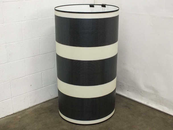 SoloPower flexible CIGS solar panel rolled into a cylinder shape — demonstrating full flexibility of the 86.75-inch panel, MC4 clips visible at top