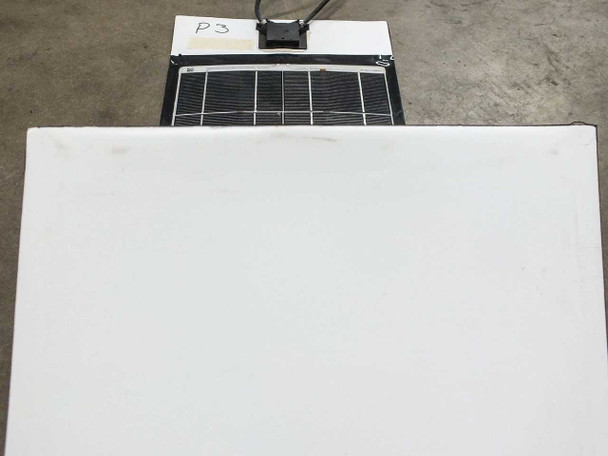 Solopower SFX1-35 connector end showing white backing and partial cell array with MC4 junction box