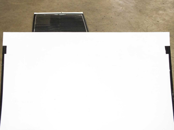 Solopower SP1 flexible solar panel showing white backing side with panel leaning upright against another panel in background
