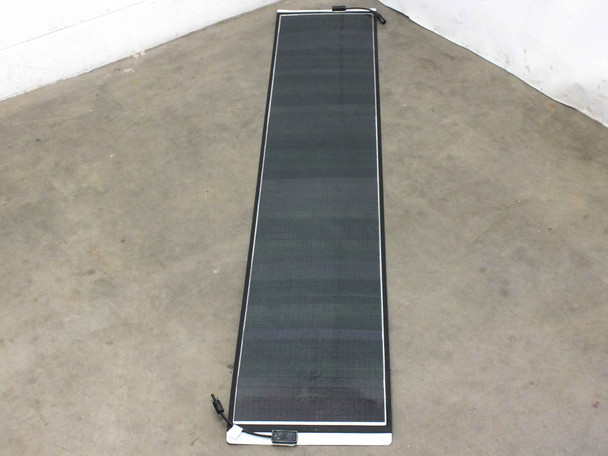 Solopower SP1 60W flexible solar panel laid flat and unrolled showing full 7.2-foot length with CIGS cell surface facing up
