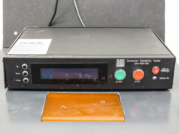 ECD Ovonics QA4-850-000 front panel — LCD display, START green button, STOP red button, TEST IN PROGRESS and Vibrator ON indicators, orange MC4 test pad in foreground
