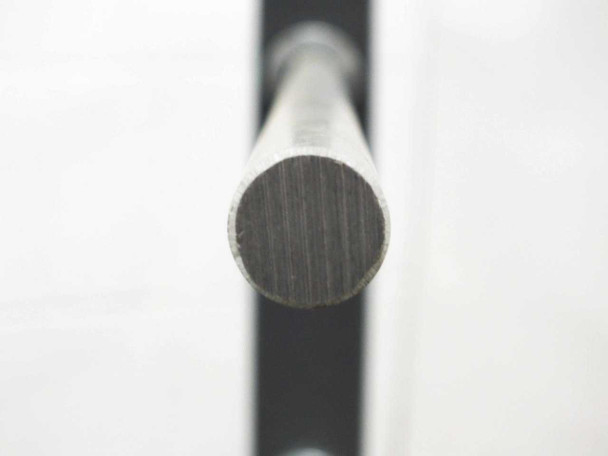 End-on close-up of 3/4-inch aluminum rod tip showing solid round cross-section