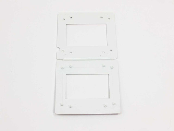 Single 35mm plastic slide mount frame shown open flat, displaying two snap-close halves with rectangular film aperture windows and alignment posts