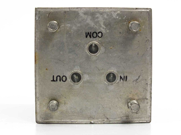 Chesapeake Inst. Corp 4547-4 bandpass filter — terminal face showing COM, OUT, and IN stud connections with mounting bolt holes