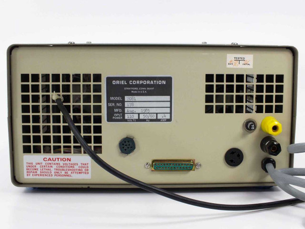 Oriel 7081 rear panel view showing DB25 parallel connector, DIN connectors, BNC connector, ventilation grille, and a TESTED sticker affixed to the upper right corner
