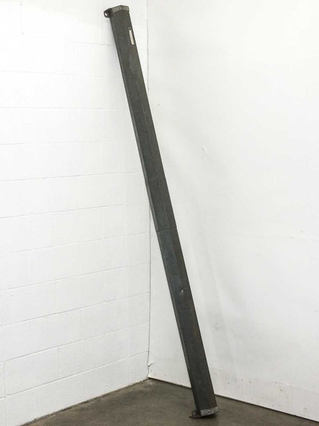 Da-Lite Model C projection screen housing leaning against wall, showing full length of steel roller case