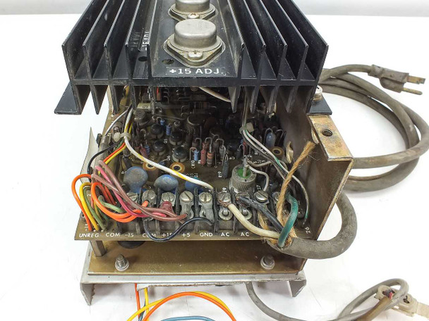 Semtrol PS105-21 interior view showing PCB terminal strip labeled UNREG, COM, -15, COM, +15, +5, GND, AC, AC and +15 ADJ trimmer pot