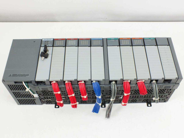 Allen-Bradley 1746-A10 SLC 500 10-slot rack angled front view showing full module complement with color-coded I/O tabs