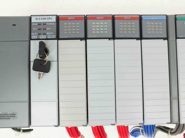 Allen-Bradley 1747-L541 SLC 5/04 CPU module close-up with RUN/FLT/BATT indicators, RS-232 port, key switch, and adjacent 1746-IA16 INPUT modules