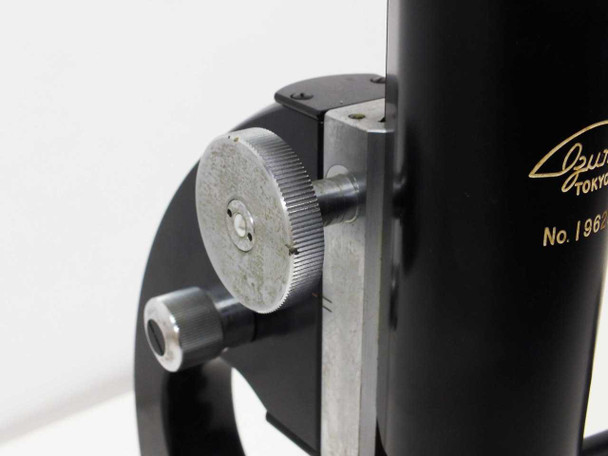 Close-up of coarse focus rack wheel mechanism on Ozumi Tokyo body arm, with gold serial number logo visible